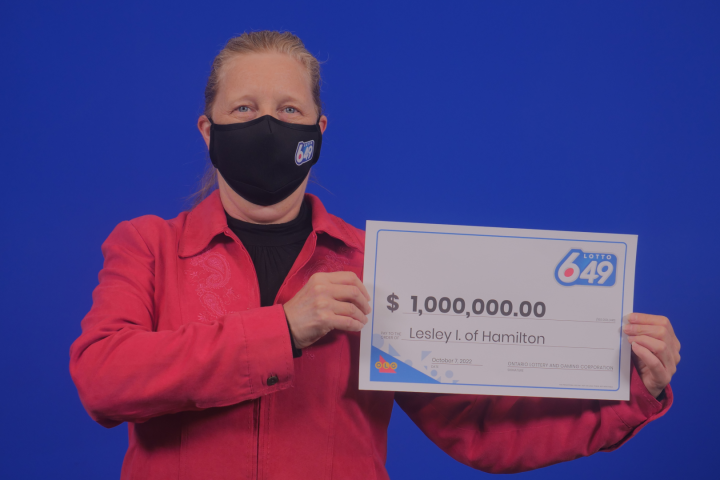 Million-dollar lottery winner from Hamilton says travel abroad in plans after collecting cheque