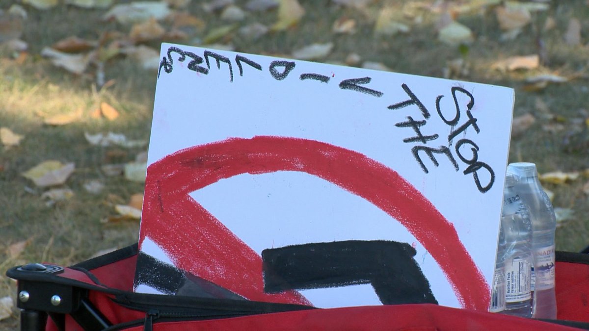 A sign can be seen at Saturday’s walk, as community members came together do discuss the violence they have seen.