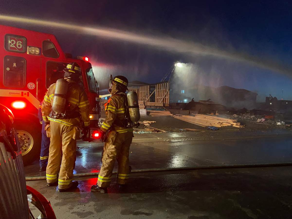 Edmonton Fire Rescue Services battle a fire at a house under construction in the city's southeast on Oct. 11, 2022.