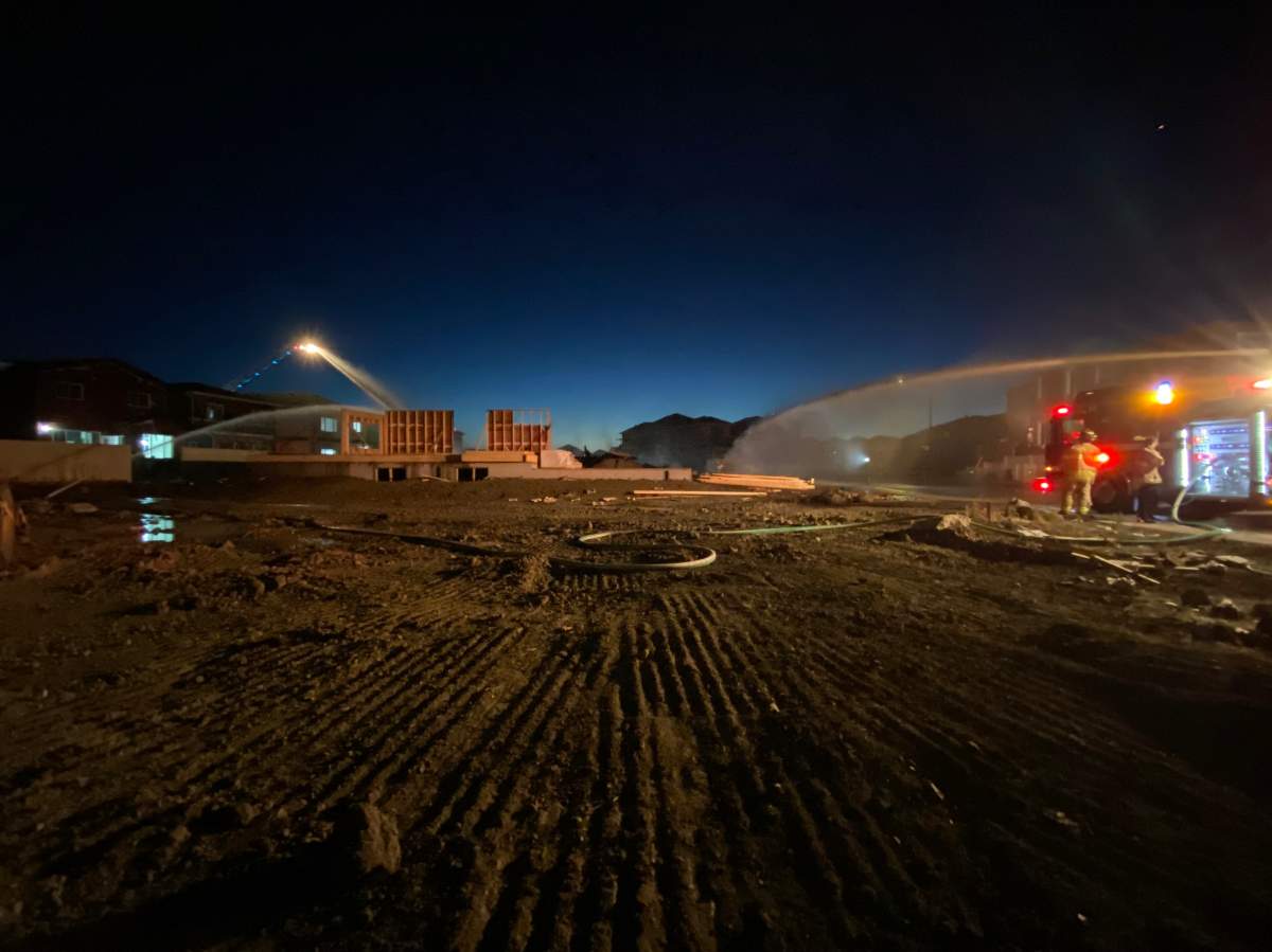 Edmonton Fire Rescue Services battle a fire at a house under construction in the city's southeast on Oct. 11, 2022.
