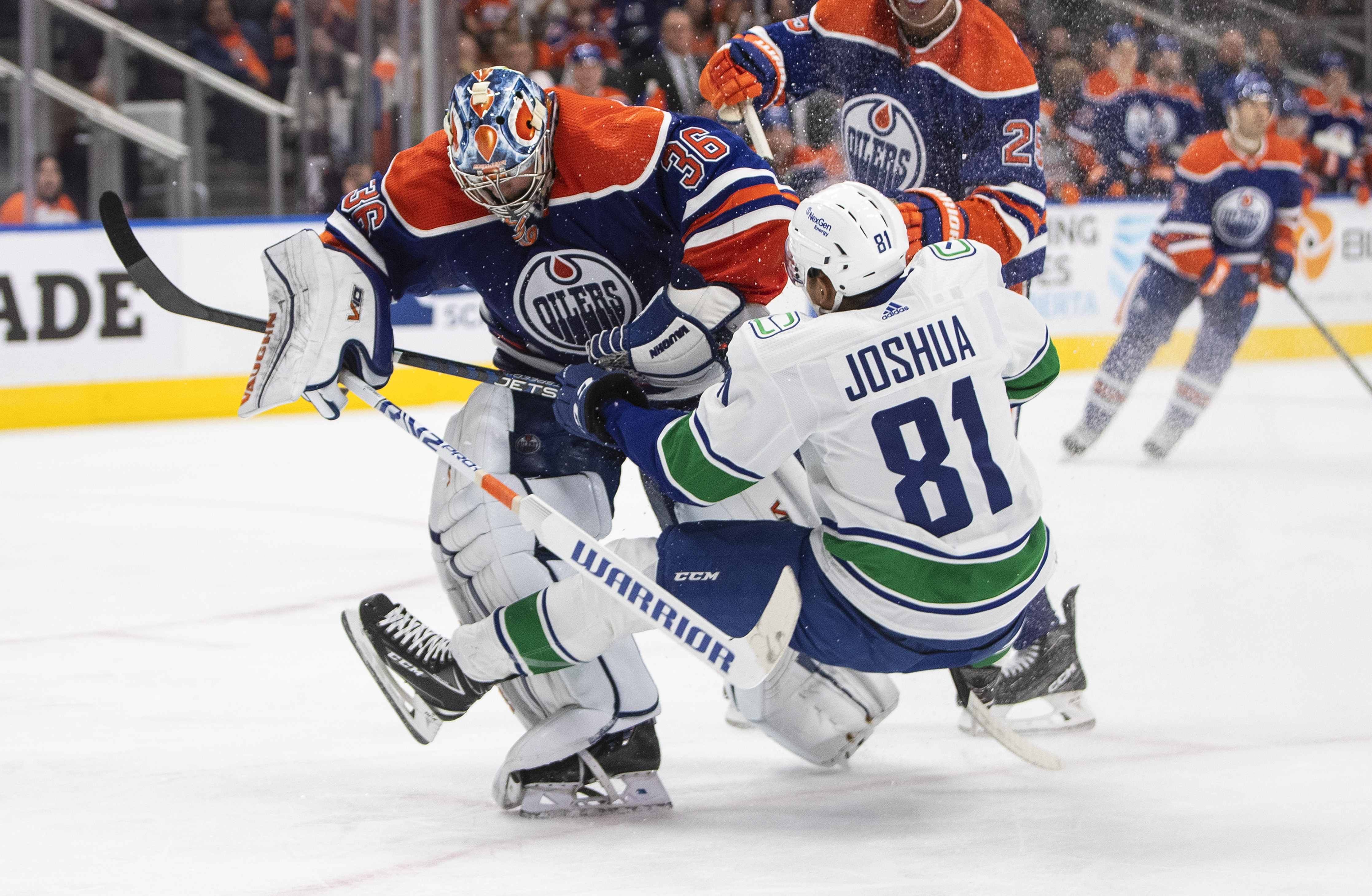 Pettersson scores twice, Canucks edge Oilers for first win of the