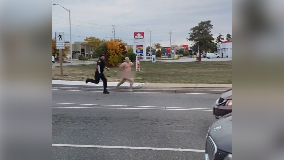 Halton police say a man who tried to evade police by running down an Oakville Road naked is likely to face multiple charges.
