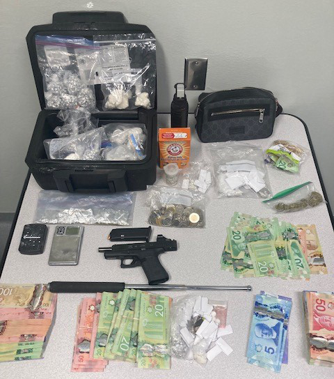 A photo of drugs, cash and a handgun that were seized by Norway House RCMP on On Sept. 28, 2022.