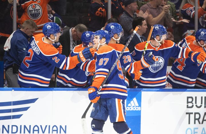 Edmonton Oilers’ Connor McDavid (97) celebrates a goal against the Vancouver Canucks during third period NHL action in Edmonton on Wednesday, October 12, 2022.