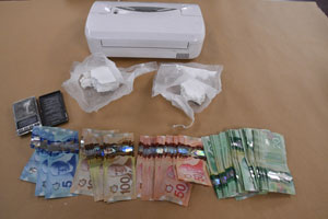 Drugs and cash seized by London, Ont., police from a residence and vehicle on Woodward Avenue on Saturday, Oct. 15.