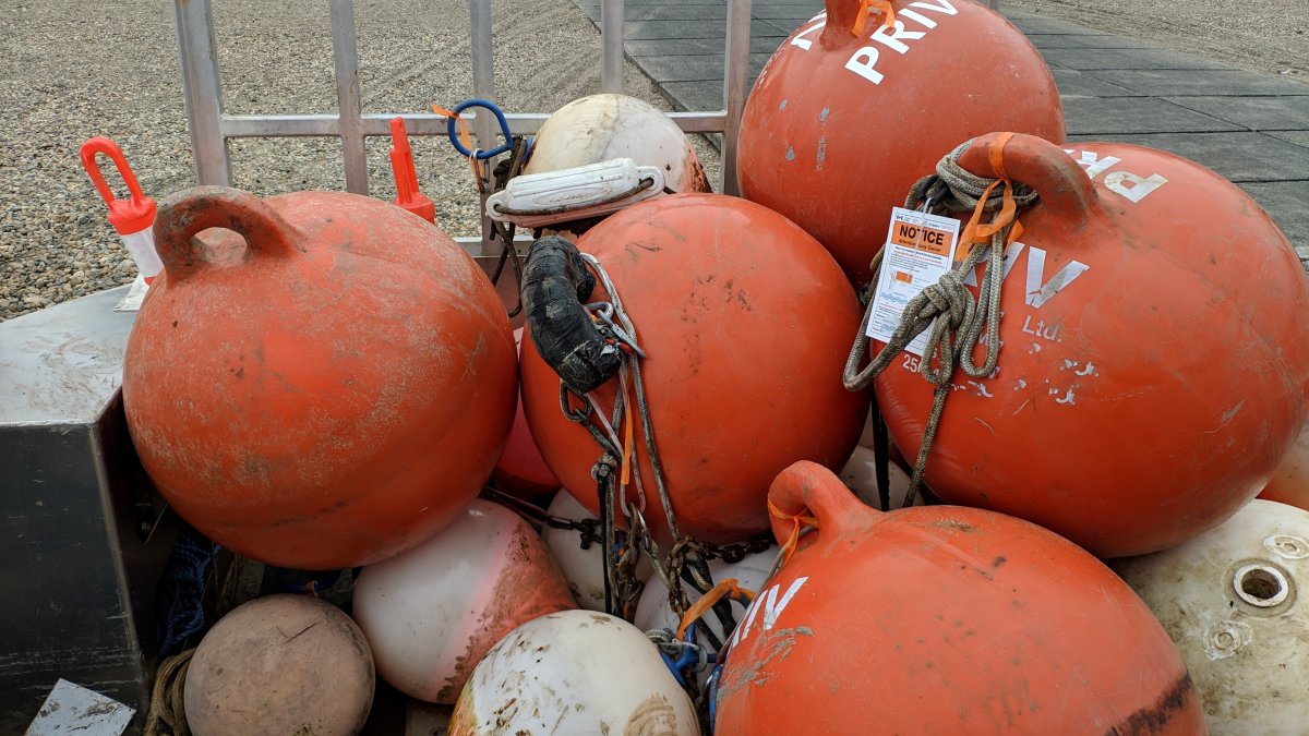 A group of the buoys seized by Transport Canada from Shuswap Lake in 2022 due to non-compliance.
