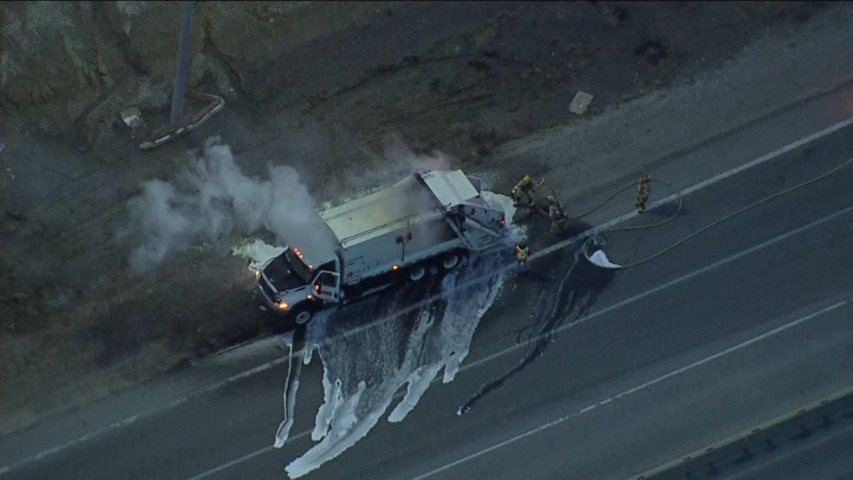 A city of Calgary garbage truck after being hit with water and foam by Calgary firefighters due to it catching fire earlier in the morning.