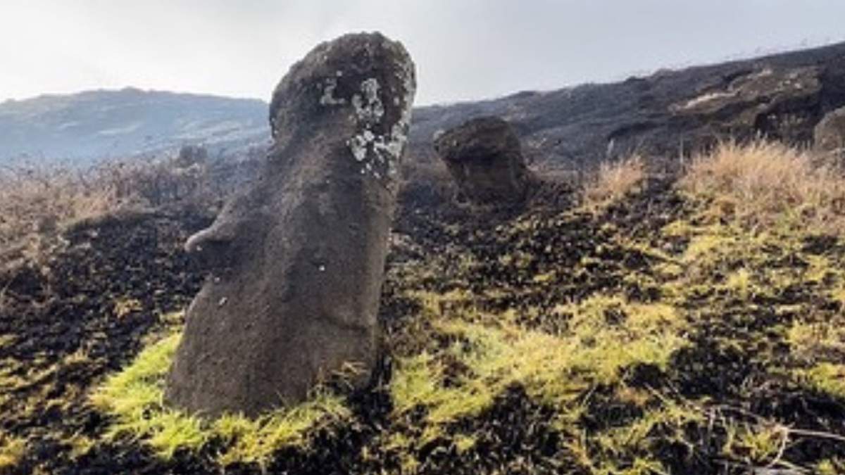 A moai on Easter Island with visible scorching damage from the fire.