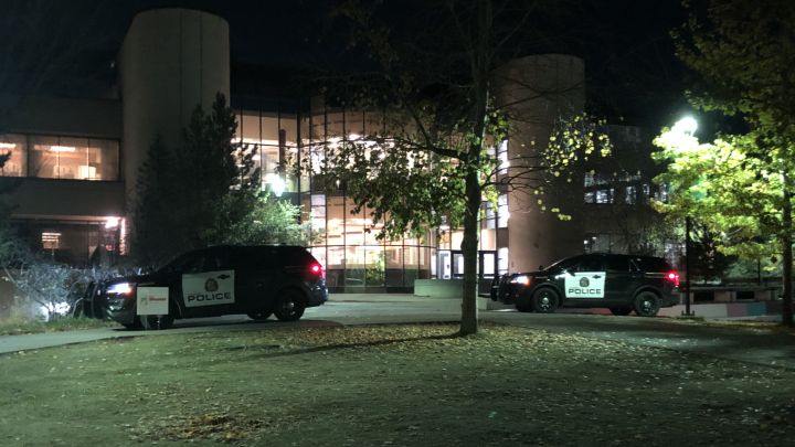 Police vehicles are seen at the University of Calgary's main campus on Oct. 25, 2022.