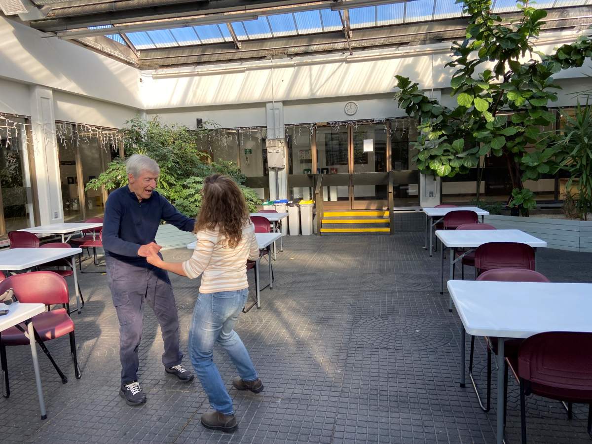 Pat and Aimee dancing in Vecova’s atrium.