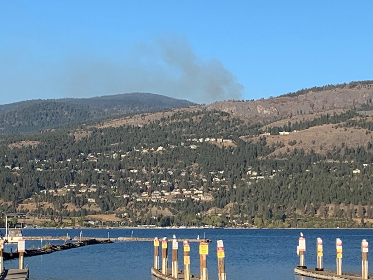 Smoke rises from a wildfire that’s located outside of West Kelowna city limits.