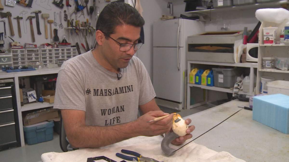 Ben Khorshidnam works on adding fake eyes to an eagle head mould in his taxidermy studio in Lethbridge, Alta.