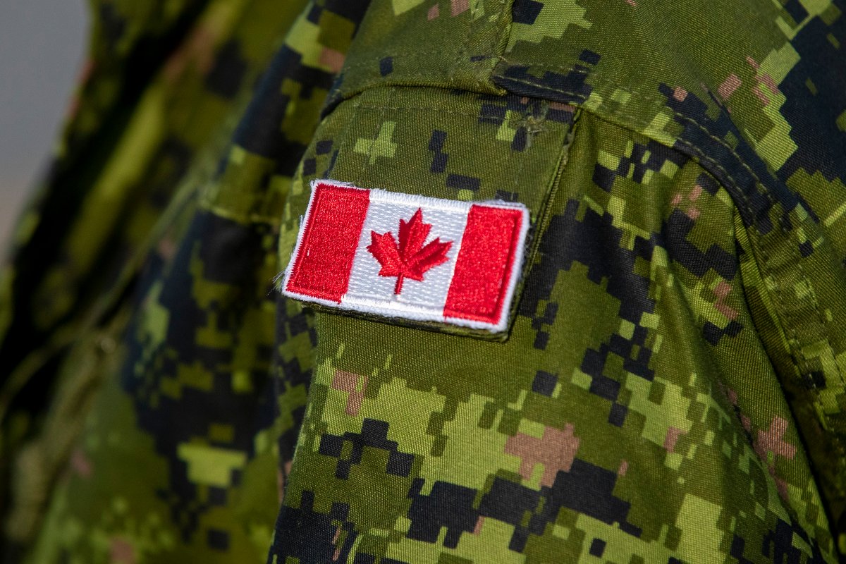 A Canadian maple leaf flag is seen on a soldier in this file photo. 