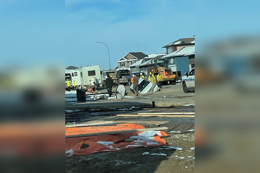 A vehicle drove into a pit dug for a water main break in northwest Regina on Oct. 26, 2022.