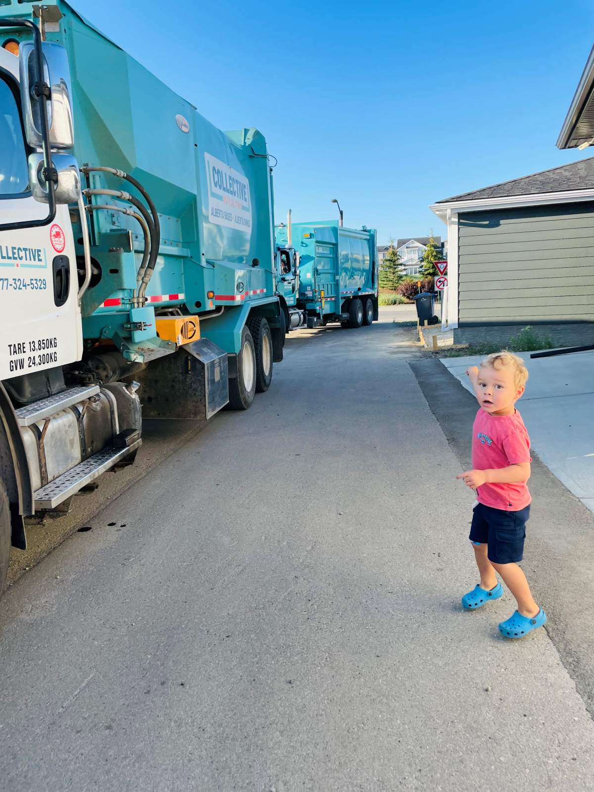 Nolan waiting for the garbage trucks.