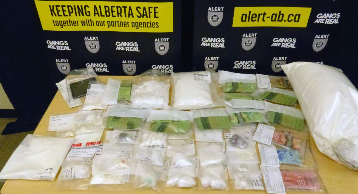 Three people from Fort McMurray, Alta., have been charged after nearly $500,000 worth of drugs and cash was seized during an ALERT investigation.