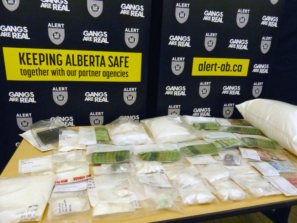 Three people from Fort McMurray, Alta., have been charged after nearly $500,000 worth of drugs and cash was seized during an ALERT investigation.