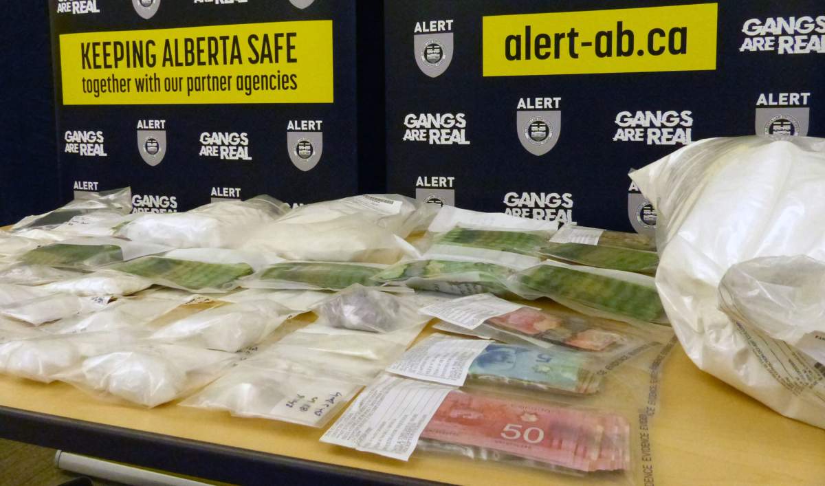 Three people from Fort McMurray, Alta., have been charged after nearly $500,000 worth of drugs and cash was seized during an ALERT investigation.
