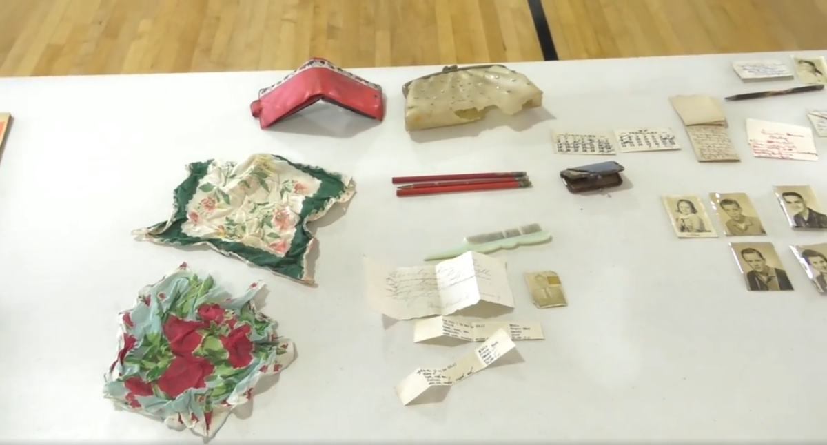 The contents of the found purse laid out on a table.