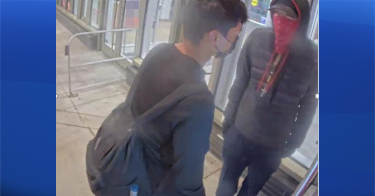 Calgary police are turning to the public to help identify a person of interest — the one wearing the red bandana — surrounding the death of a man in East Village on Oct. 25, 2022.