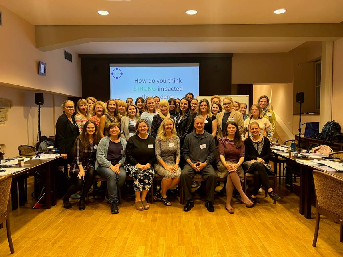 (Front row) Claire Crooks (left from centre), Sharon Hoover (centre), and Dr. Jeff Bostic (right from centre) with STRONG training participants, Sept. 2022 in Prague, Czech Republic.