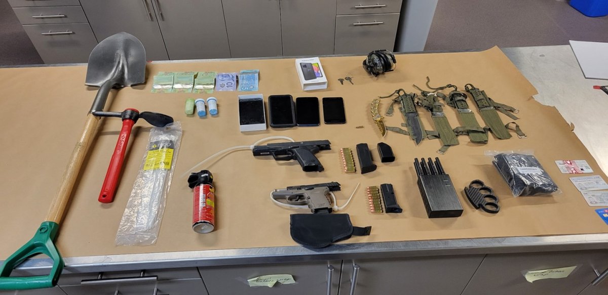 RCMP found a man passed out in his car with a massive cache in weaponry. 