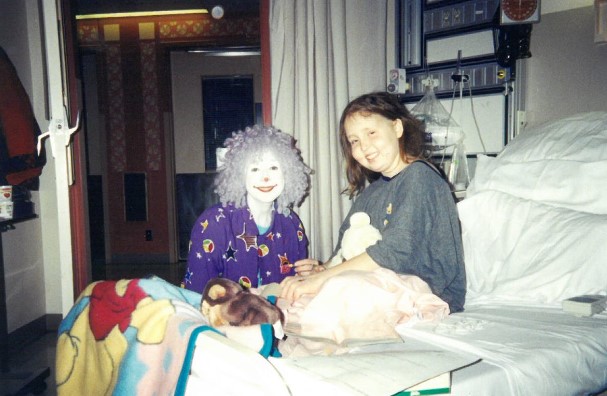 Kirsten Efromov sits in a hospital bed in 1998.