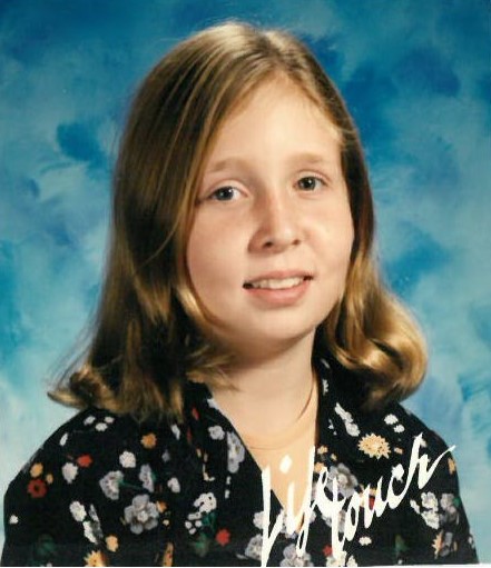 Kirsten Efromov appears in her Grade 6 school photo.