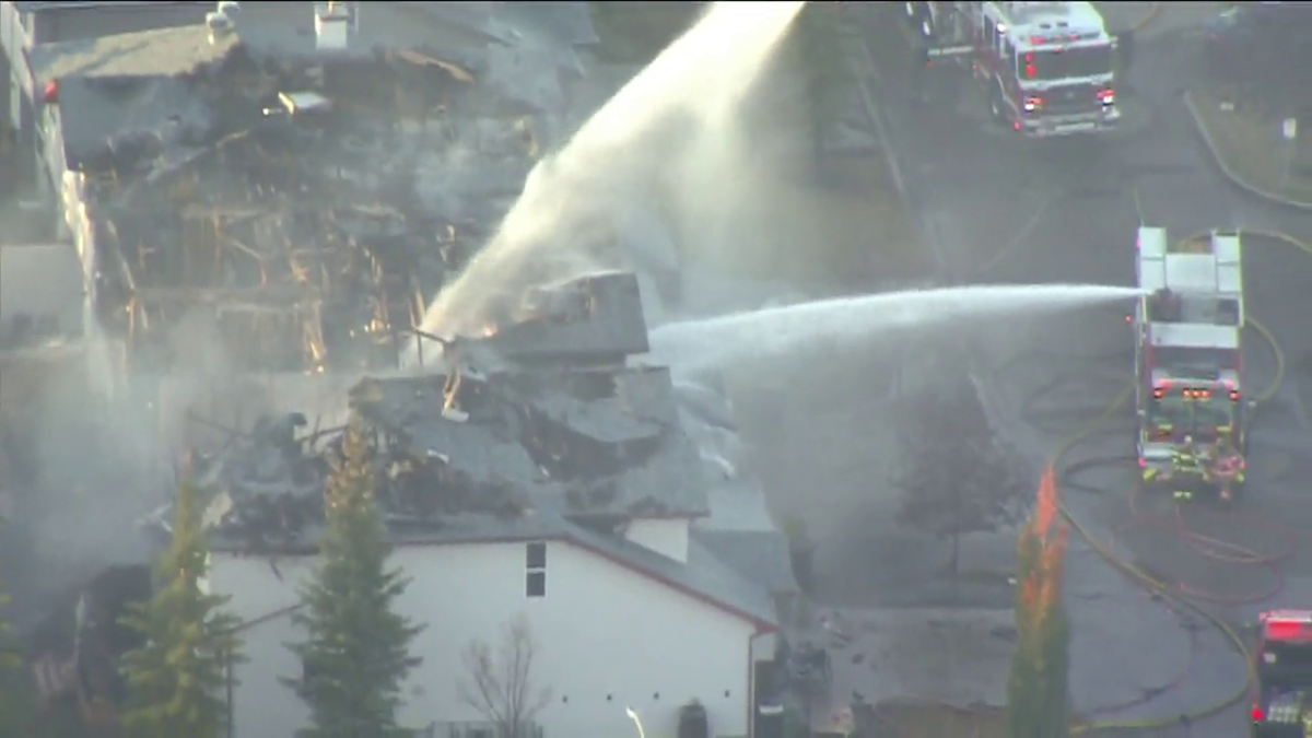 Crews from the Fort Saskatchewan Fire Department work to put out a structure fire Oct. 16, 2022.
