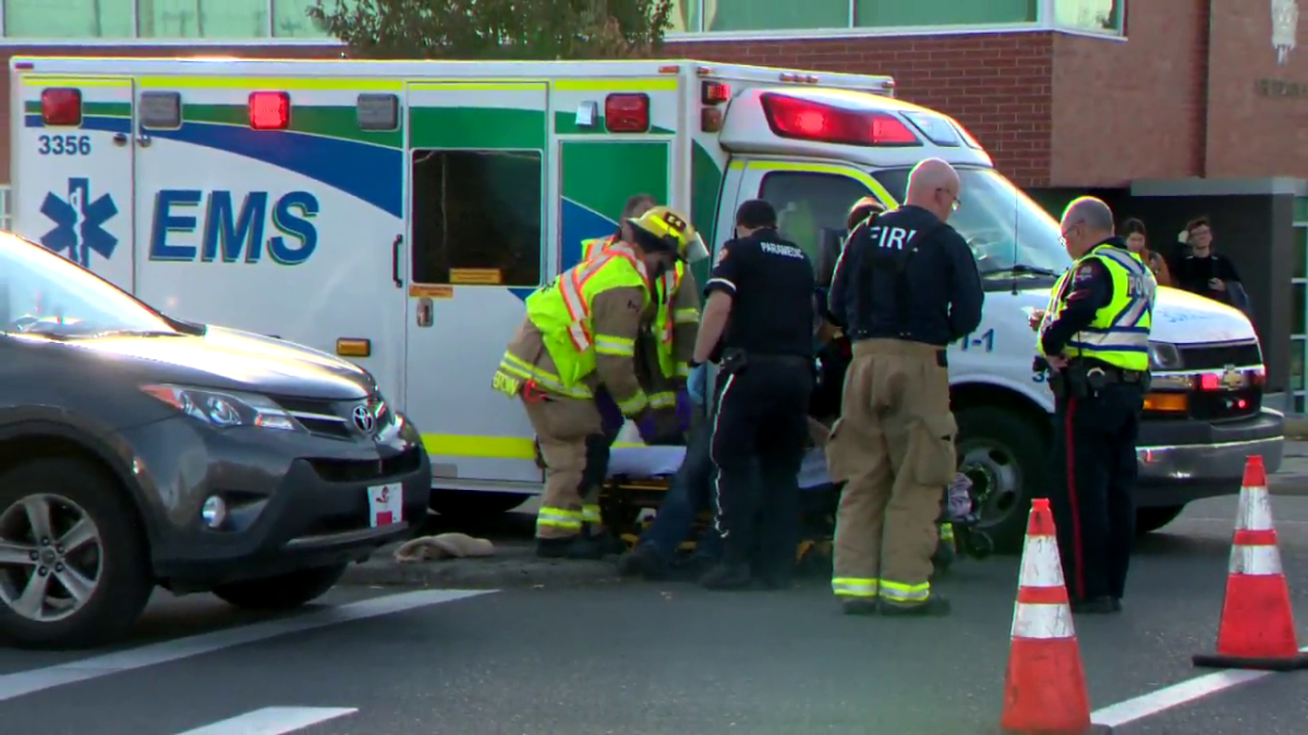 Emergency responders attend to a pedestrian involved in a hit and run at the corner of 19 Street and 18 Avenue N.E. on Oct. 13, 2022.