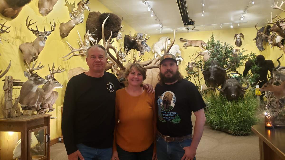 Kevin Wiebe (left), Kelly Wiebe (centre), and Levi Wiebe (right) run Top Notch Taxidermy in Coaldale, Alta. Their business has been operational for 35 years.