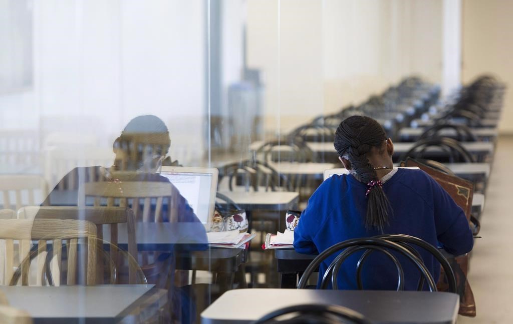 A young woman studies at the College de Maisonneuve in Montreal, Sunday, March 13, 2016.  THE CANADIAN PRESS/Graham Hughes.