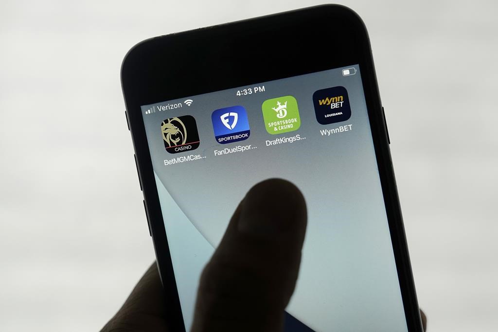 FanDuel, DraftKings and other online gambling apps are displayed on a phone in San Francisco, Monday, Sept. 26, 2022. (AP Photo/Jeff Chiu).