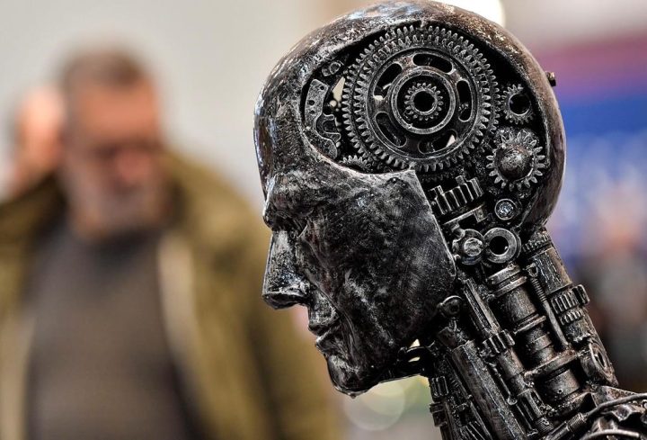 In this Nov. 29, 2019, file photo, a metal head made of motor parts symbolizes artificial intelligence, or AI, at the Essen Motor Show for tuning and motorsports in Essen, Germany. New research shows Ontario's artificial intelligence industry was seeing tremendous growth in jobs and investments ahead of the broader tech downturn that materialized earlier this year, but the sector is unlikely to remain unscathed. 