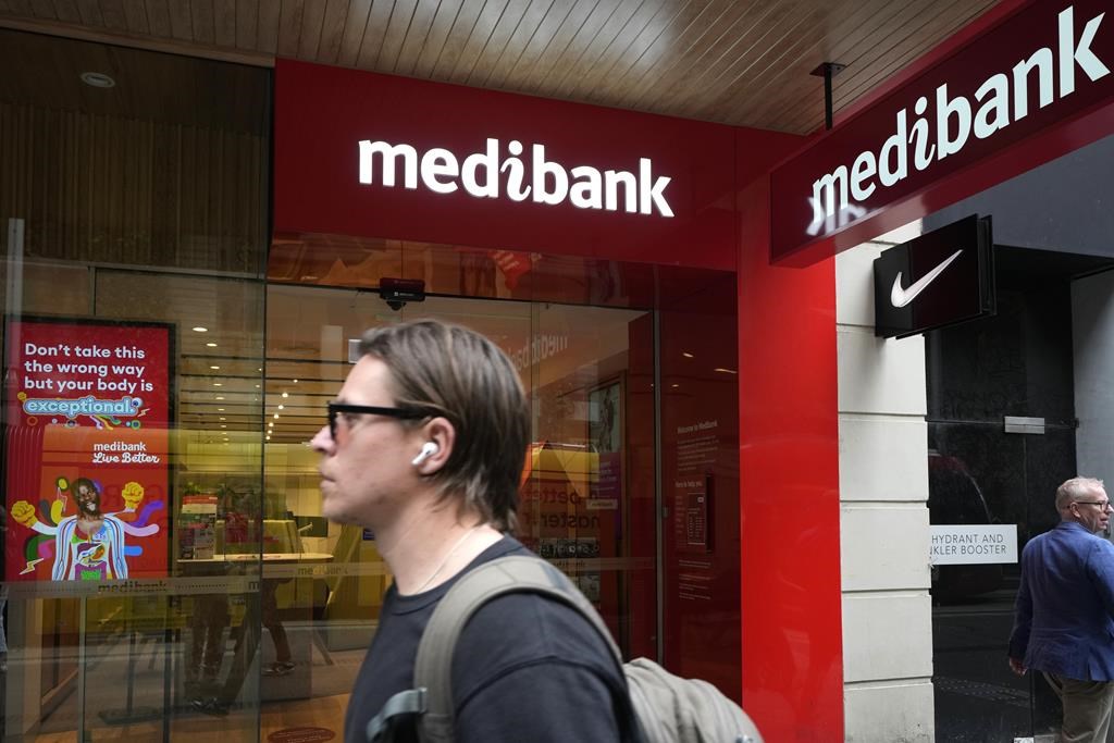 Person walks past a Medibank office in Sydney, Australia