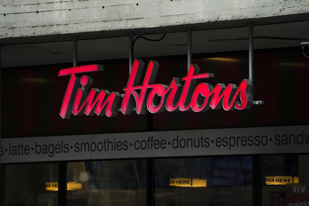 Tim Hortons signage is pictured in Ottawa on Wednesday Sept. 7, 2022. A Tim Hortons branded chicken noodle soup base was recalled in Alberta and Ontario because it contained insects.