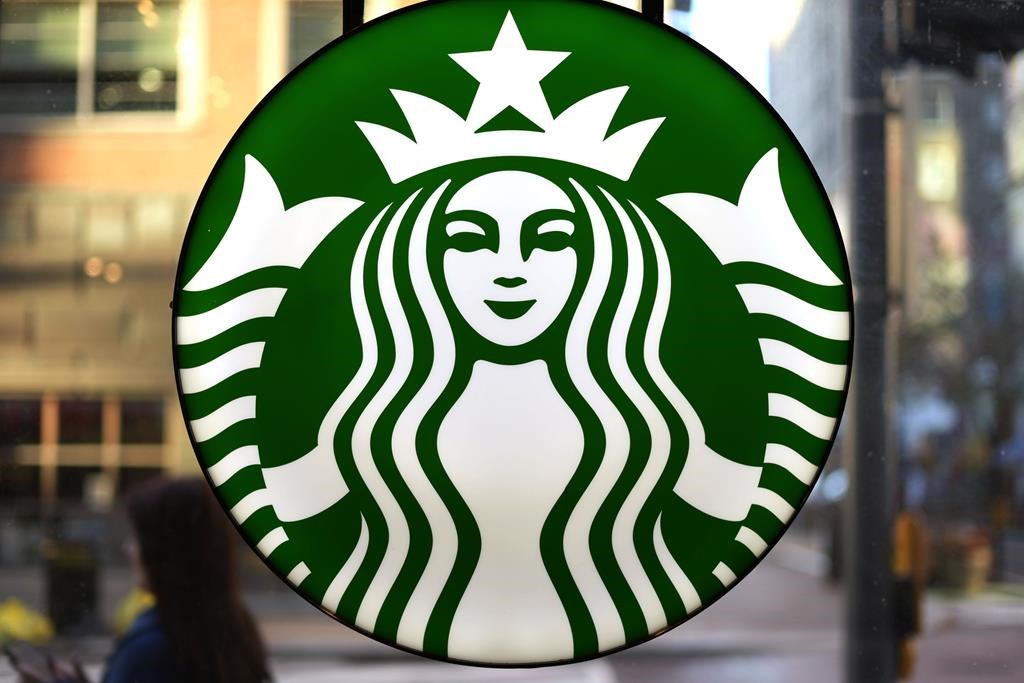 FILE - The Starbucks logo is displayed in the window of a downtown Pittsburgh Starbucks on Monday, Nov. 7, 2022. 