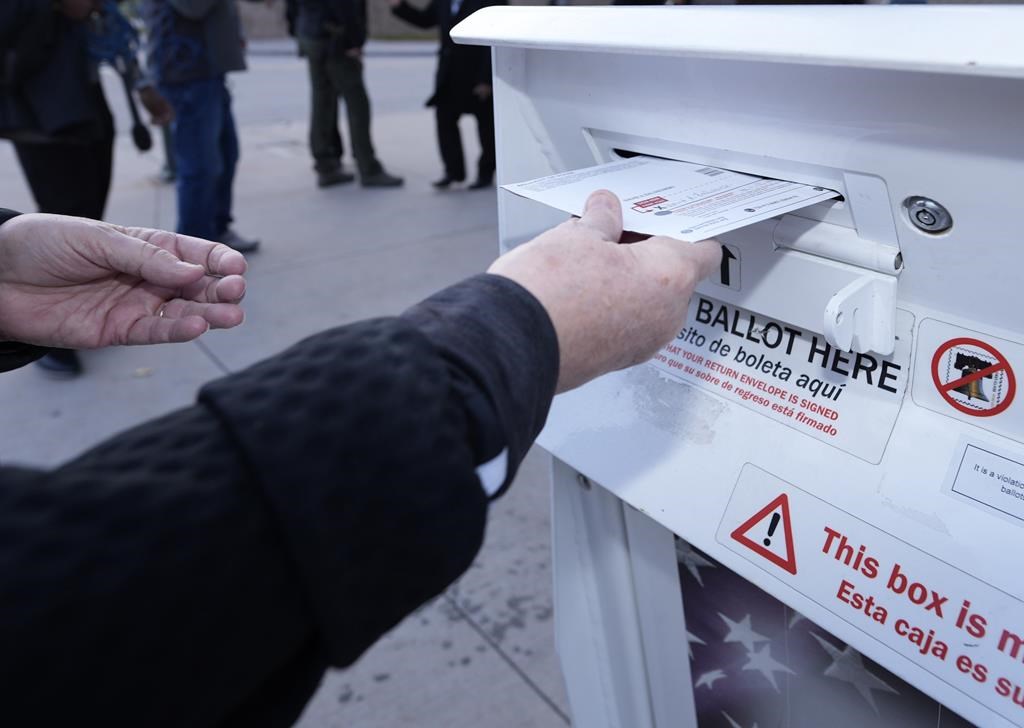A voter places a ballot in a drop box as seen in this 2022 file photo.