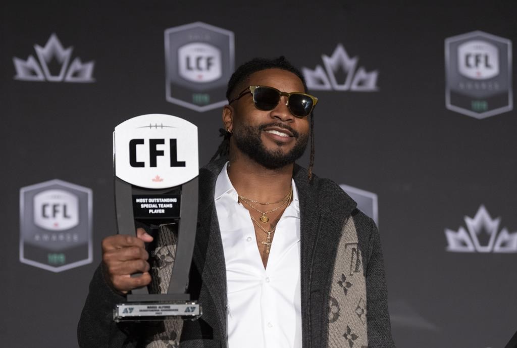 Most outstanding special teams player, returner Mario Alford of the Saskatchewan Roughriders, holds up his trophy during the CFL Awards in Regina, Thursday, Nov. 17, 2022. THE CANADIAN PRESS/Paul Chiasson