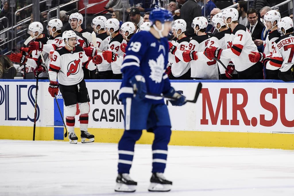 Devils win 11th straight, edging Maple Leafs 3-2 in OT
