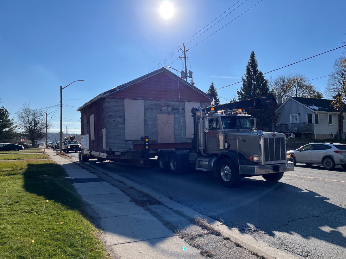 The Fugitive Slave Chapel slowly makes its way north on Highbury Avenue from Hamilton Road on Nov. 22, 2022. The chapel is being relocated to Fanshawe Pioneer Village, where it will be restored and used as an educational piece.
