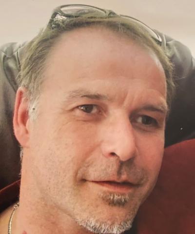 Police have identified the missing swimmer as Paul Davis, 57.