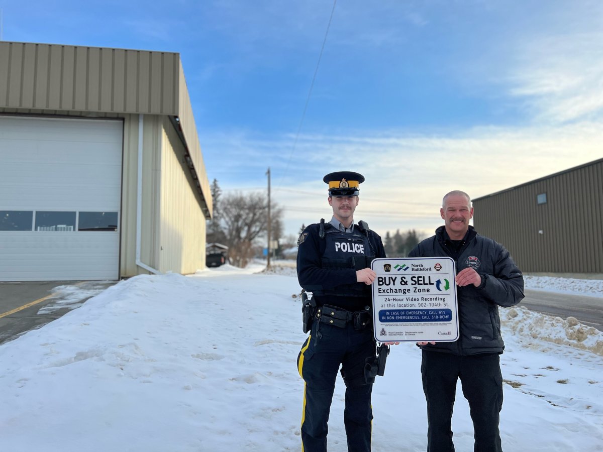 Cst. Harlow-Fossum with Battleford RCMP and the North Battleford City’s Director of Protective Services/Fire Chief, Lindsay Holm standing in front of the Buy & Sell Exchange Zone, located on the south side of the North Battleford Fire Department.