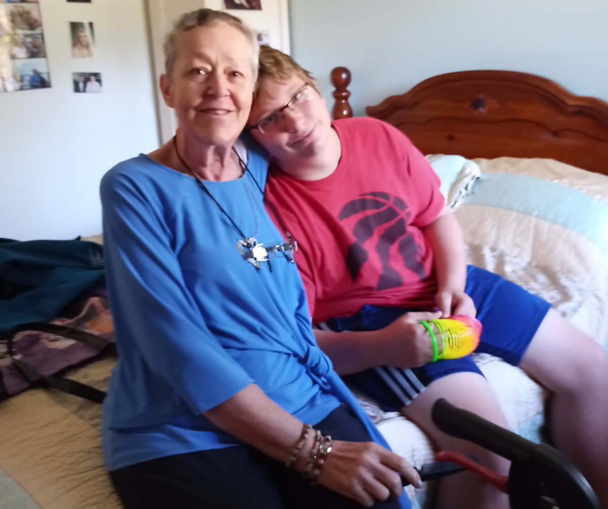 Anne Isenor and her grandson William McGill sit in Isenor’s nursing home room as shown in this handout image. Lesley McGill, Isenor’s daughter and William’s mother, provided care to both of them for five years, as William was treated for leukemia.