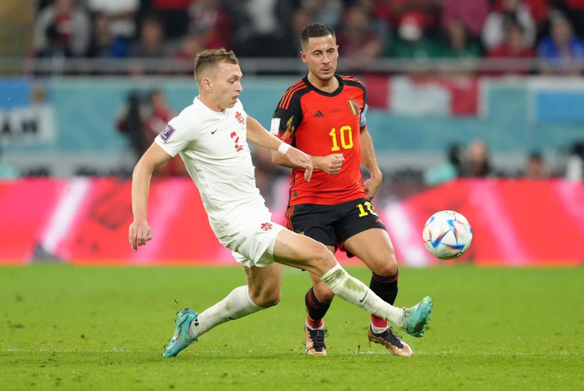 Canada’s Alistair Johnston (left) and Belgium’s Eden Hazard battle for the ball during the FIFA World Cup Group F match at the Ahmad bin Ali Stadium, Al Rayyan. Picture date: Wednesday November 23, 2022.
