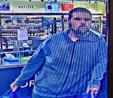 Police in Grenville county say this man is responsible for the theft of 18 liquor bottles from a local store.