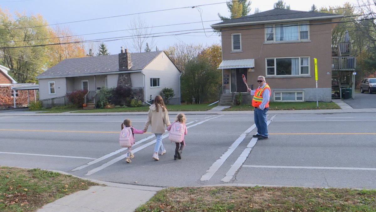 Parents and children stopped to say thank you to Arthur Szola as he closed out his crossing guard career.