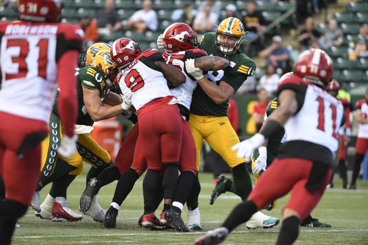 Elks OL David Foucault blocks in a game against the Stampeders