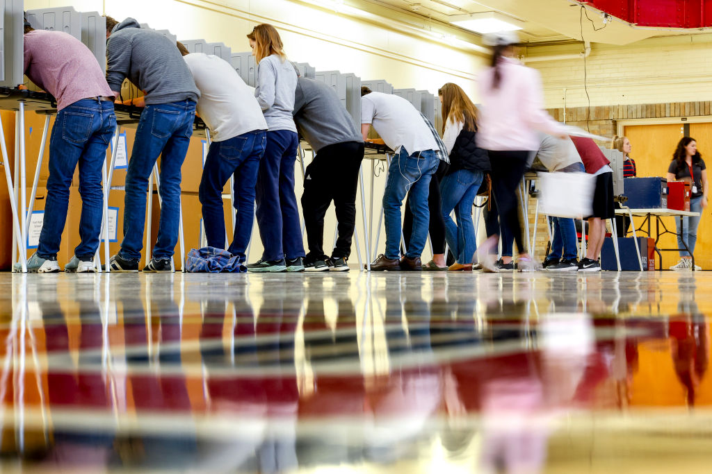 File - People vote at Denver East High School on November 8, 2022 in Denver, Colorado. After months of candidates campaigning, Americans are voting in the midterm elections to decide close races across the nation. 