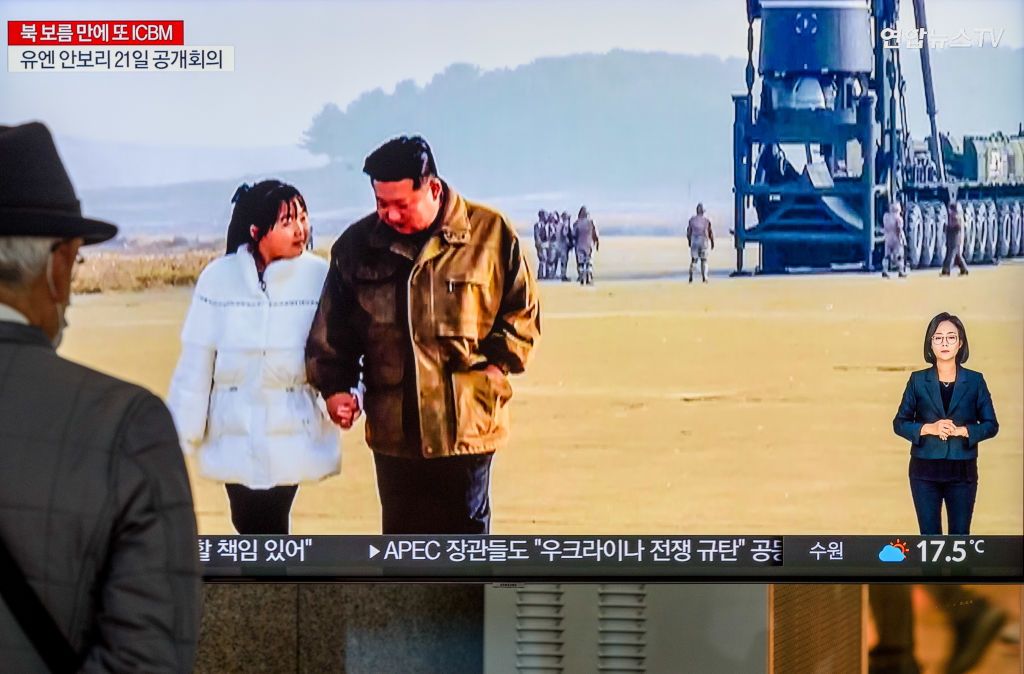 A TV screen shows North Korea’s KCNA released pictures of North Korean leader Kim Jong Un and his daughter during a news program at the Yongsan Railway Station in Seoul, South Korea.